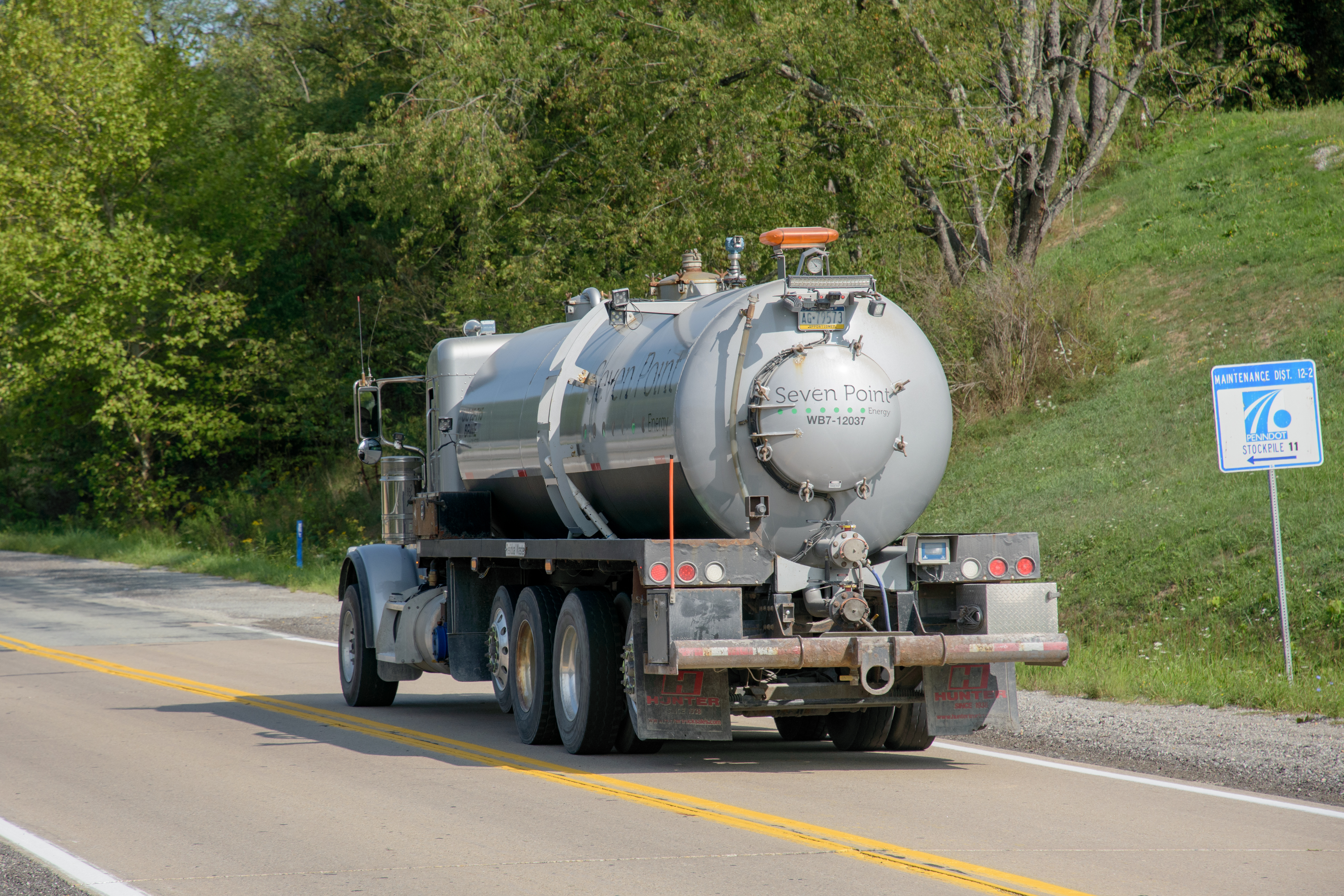 A fracking fluid truck from a local company, Seven Point, drives past one of EQT’s fracking water storage facilities in Kirby, PA. Ten and fifteen-ton trucks regularly thunder down rural, one-lane gravel roads, carrying fracking fluid for gas wells, waste for landfills, or equipment to
coal mines.